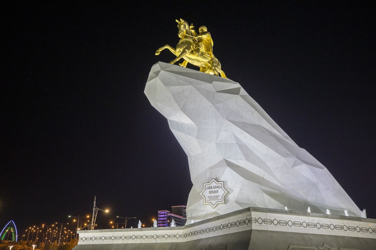 Capital city of Turkmenistan: Ashgabat ASHGABAT, TURKMENISTAN - NOVEMBER 24: A view of the Monument to President of Turkmenistan Gurbanguly Berdimuhamedov, cast in bronze and covered in 24-carat gold leaf in Ashgabat, Turkmenistanon November 24, 2021. Ashgabat is the capital and the largest city of Turkmenistan. It is situated between the Karakum Desert and the Kopet Dag mountain range in Central Asia. It is also near the Iran-Turkmenistan border. Aytac Unal / Anadolu Agency (Photo by Aytac Unal / ANADOLU AGENCY / Anadolu Agency via AFP)