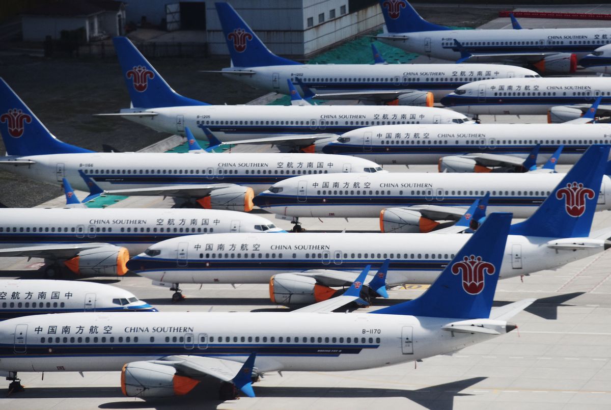 This photo taken on June 5, 2019 shows grounded China Southern Airlines Boeing 737 MAX aircraft parked in a line at Urumqi airport, in China's western Xinjiiang region. - China was the first country to ground the 737 MAX, a day after a deadly crash of an Ethiopian Airways Boeing 737 MAX that killed all 157 people on board, on March 10. Chinese carriers are seeking compensation from Boeing for losses due to the grounding of the  planes. (Photo by GREG BAKER / AFP)