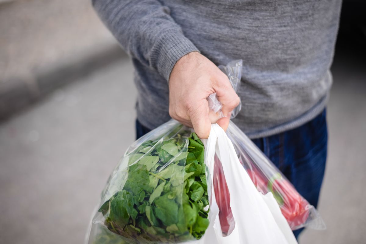 Male,Carrying,Bag,In,His,Hand,After,Shopping.,Closeup,Of