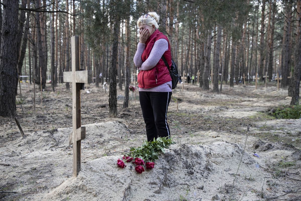 Ukrainian woman mourns over her deceased husband