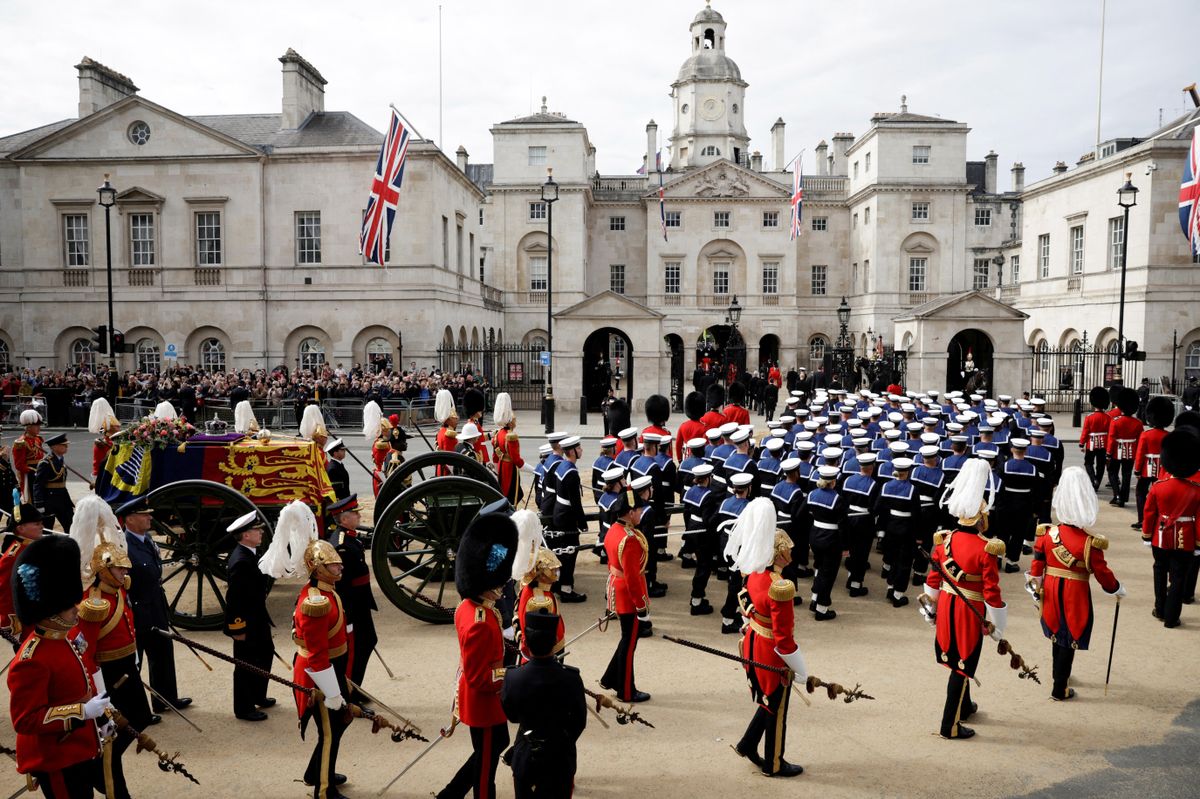 The coffin of Queen Elizabeth II, is accompanied by Royal Navy sailors on September 19, 2022, making its final journey to Windsor Castle in London after the State Funeral Service of Britain's Queen Elizabeth II. (Photo by ALKIS KONSTANTINIDIS / POOL / AFP)