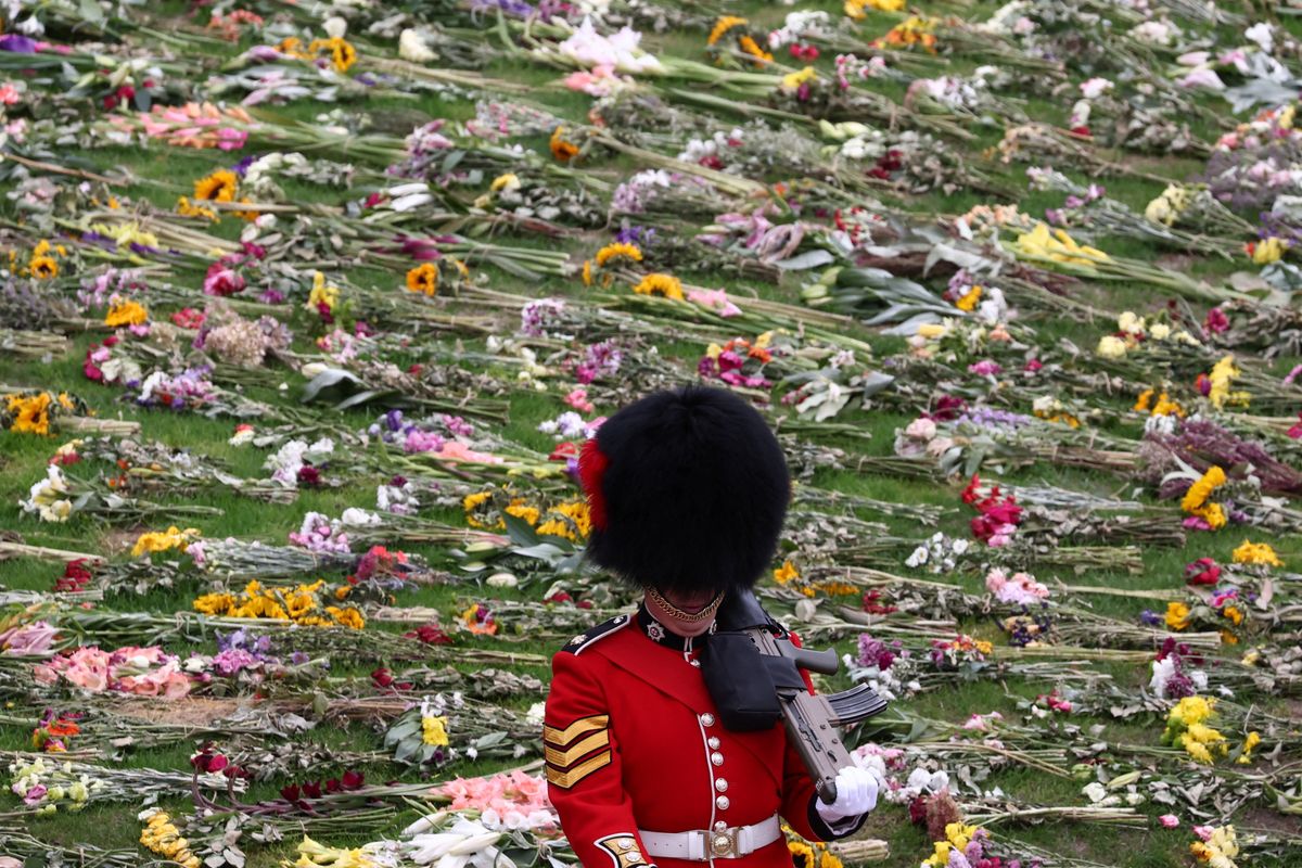A Royal Guard stands guard on the day of the state funeral and burial of Britain's Queen Elizabeth, at Windsor Castle in Windsor, Britain, September 19, 2022. (Photo by HENRY NICHOLLS / POOL / AFP)