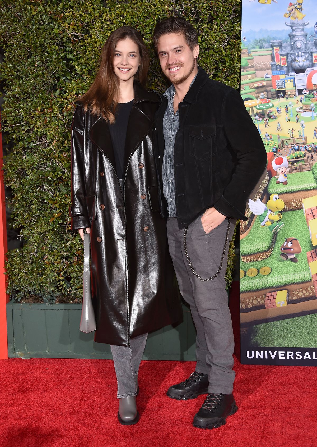 Hungarian model Barbara Palvin (L) and Italian-US actor Dylan Sprouse arrive for Universal Studios' Super Nintendo World celebration event in Universal City, California, on February 15, 2023. The park offically opens to the public on February 17, 2023, and marks Super Nintendo World's arrival in the United States. (Photo by LISA O'CONNOR / AFP)