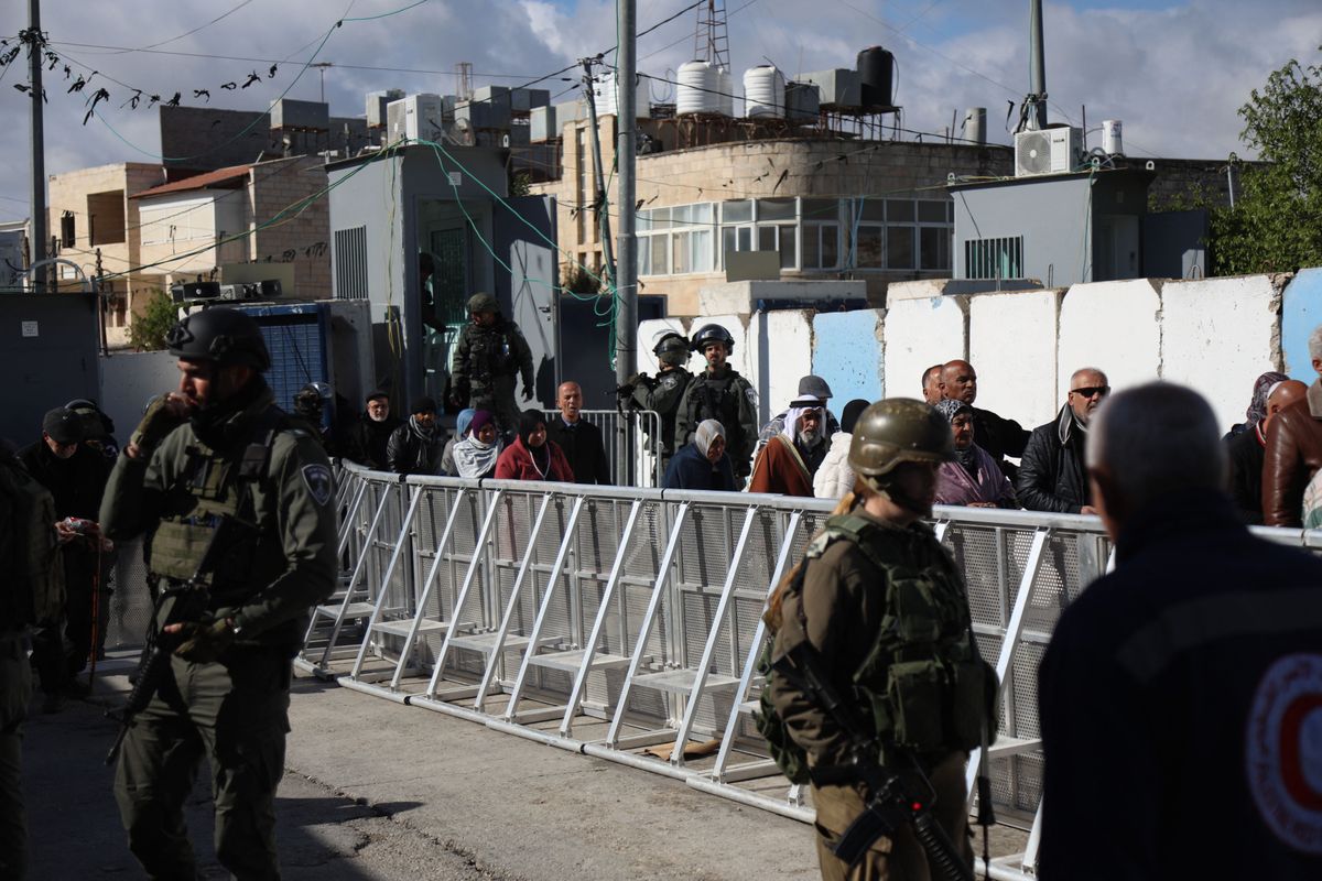 Palestinians pass through checkpoint to perform friday prayer at Masjid al-Aqsa