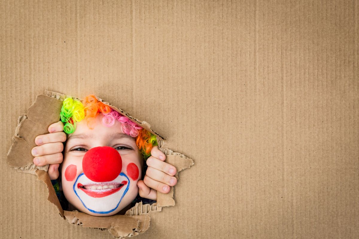 Funny,Kid,Clown,Looking,Through,Hole,On,Cardboard.,Child,Playing