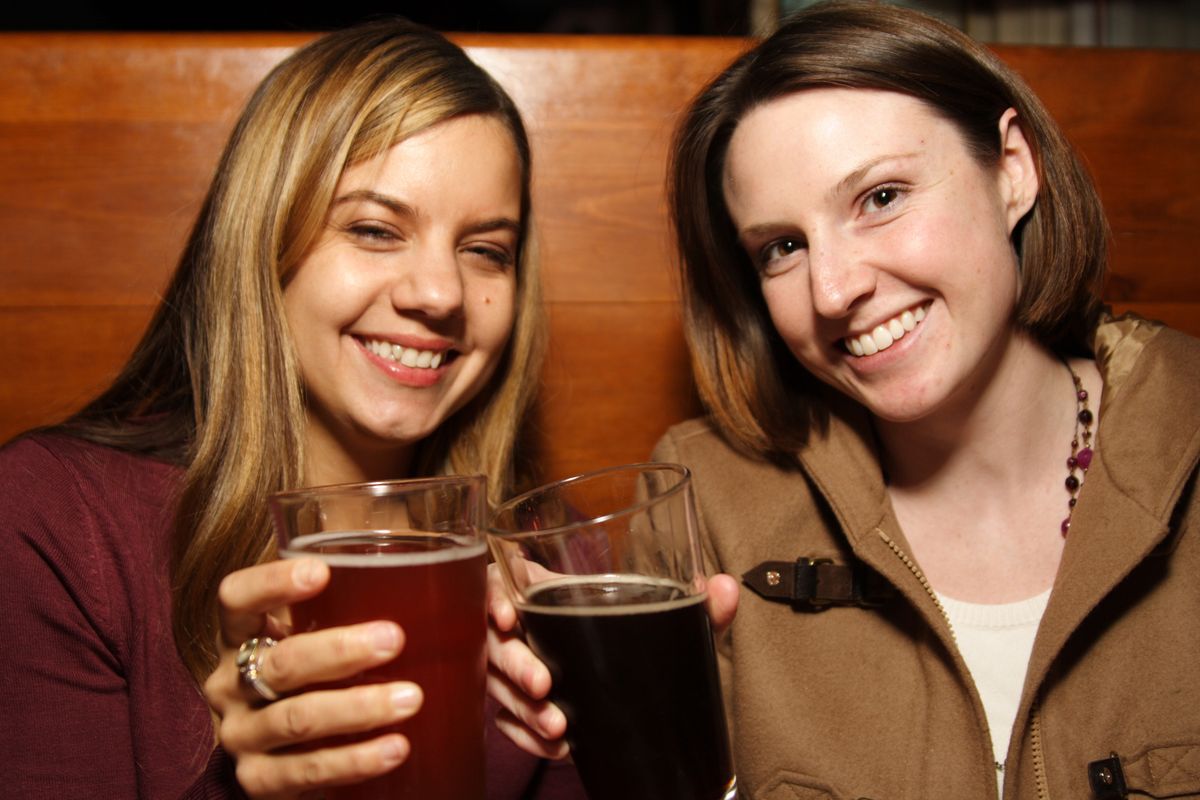 girls enjoying beers in a restaurant