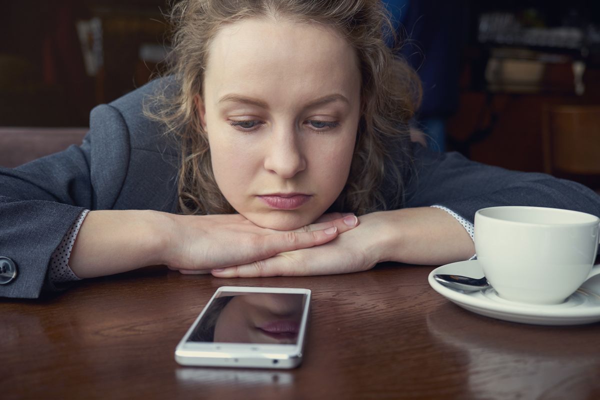 Disappointed,Sad,Woman,Looking,At,Phone,And,Waiting,Message,Or