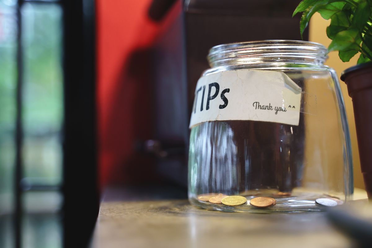 Glass,Tips,Jar,In,Cafe,With,Few,Thai,Coins