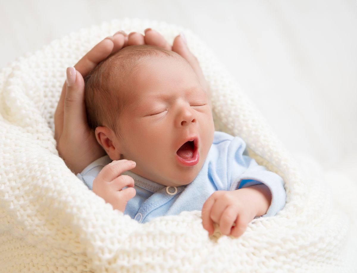 Newborn,Baby,Sleeping,In,Mother,Hands,,New,Born,Boy,With