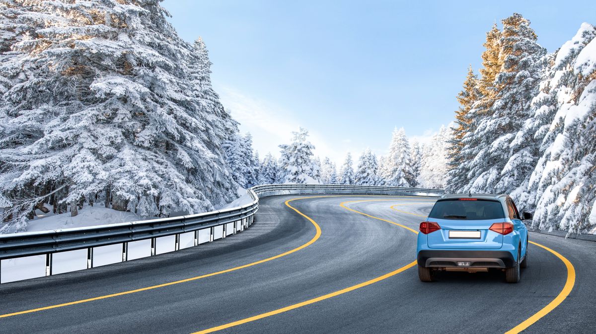 Blue,Suv,Car,Driving,On,Nature,Road,In,Snowy,Forest