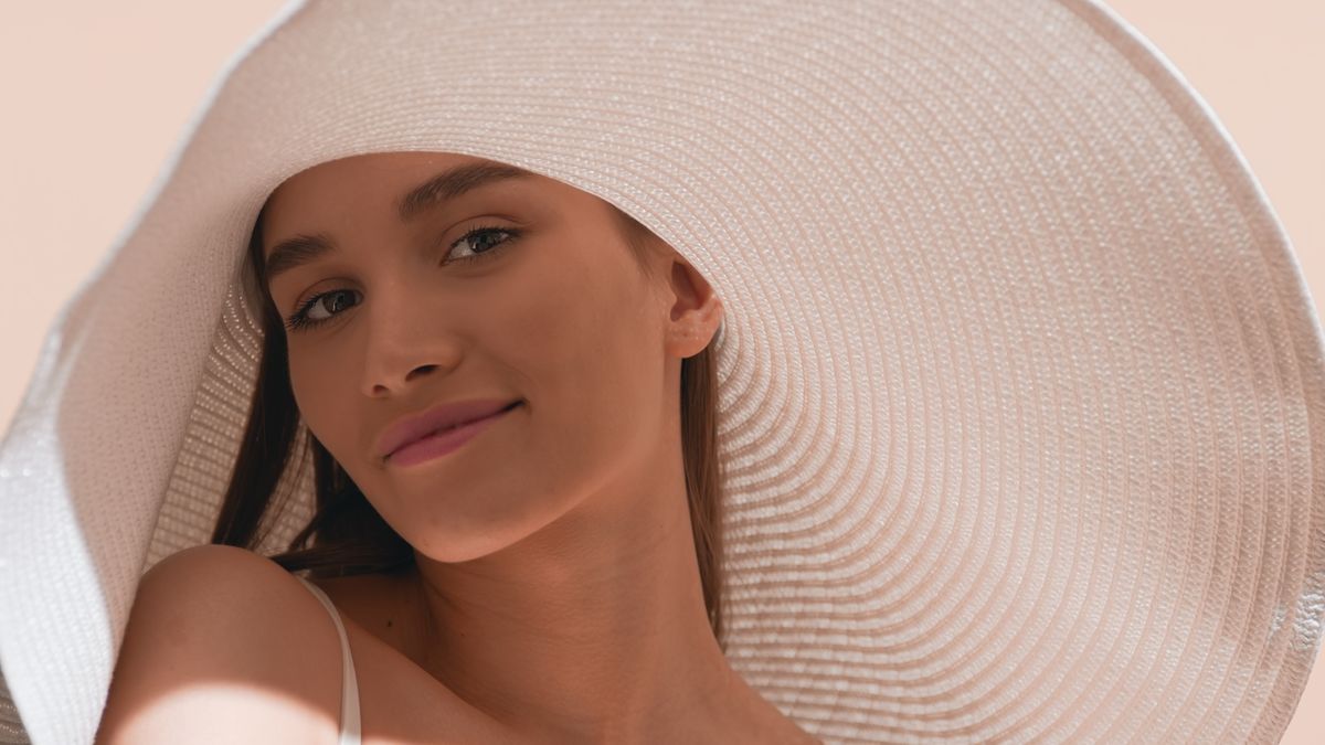 Young,Gorgeous,Dark-haired,European,Woman,In,A,Big,White,Hat