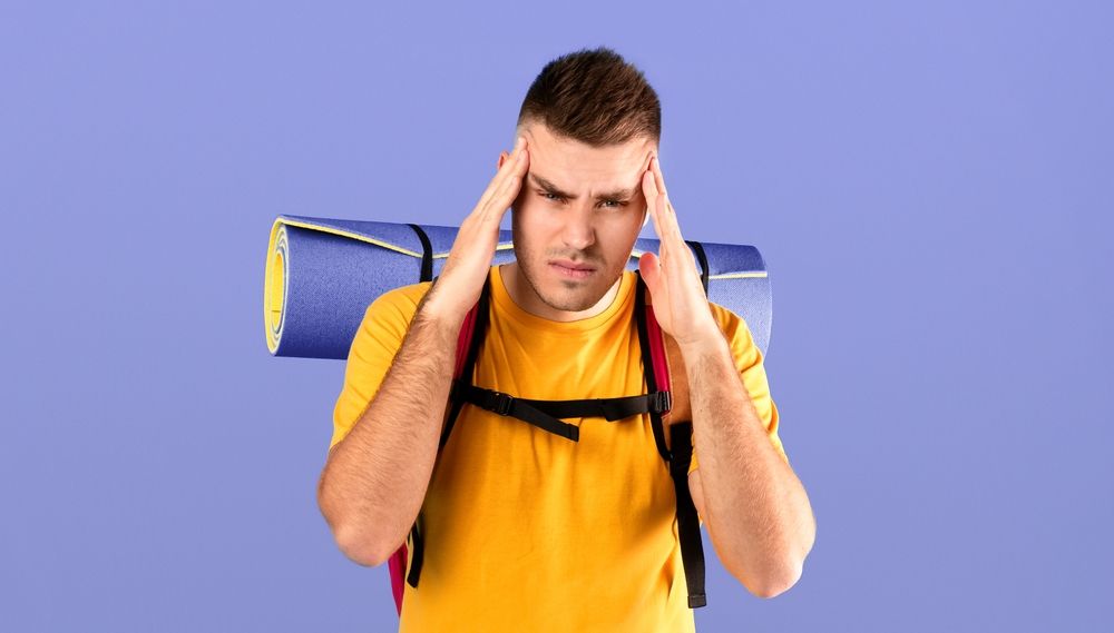 Unhappy,Male,Tourist,With,Camping,Gear,Suffering,From,Headache,On