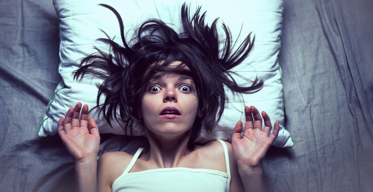 Young,Girl,With,A,Frightened,Expression,Wakes,Up,From,A