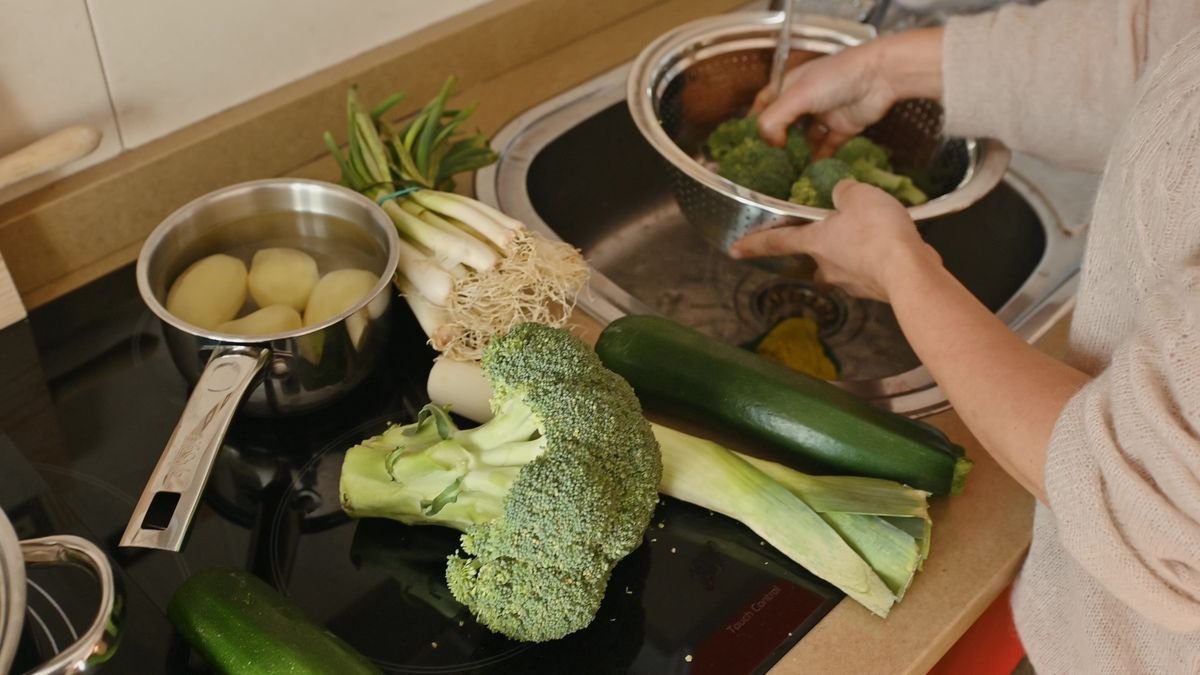 A,Woman,Prepares,Fresh,Vegetables,For,Cooking,,Promoting,Healthy,Eating